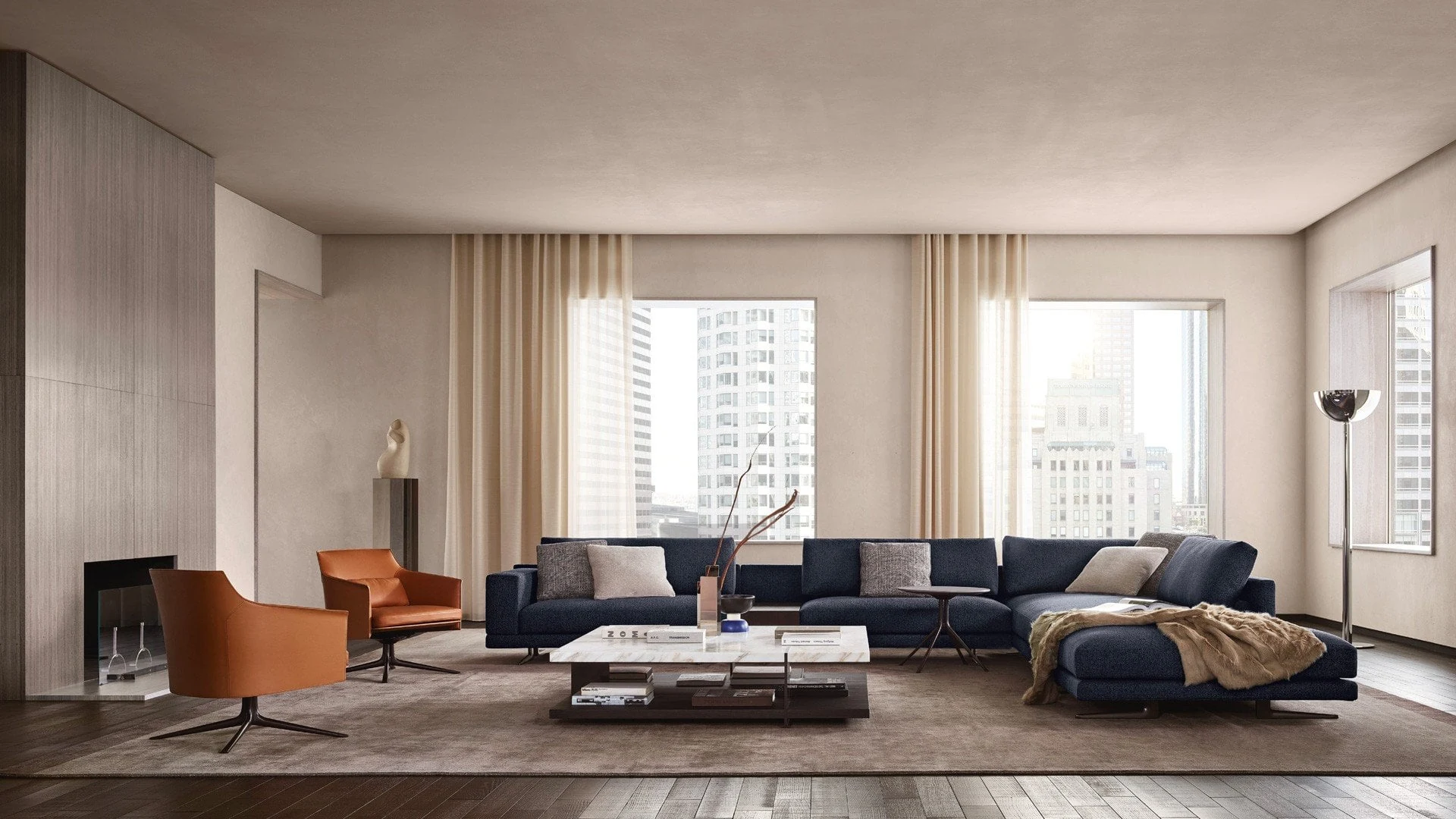 Poliform Mondrian navy sectional sofa with cognac leather chairs in a bright city apartment