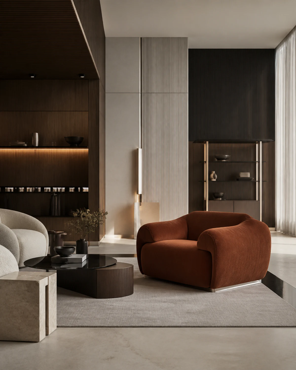 A dark-panelled lounge with a rust bouclé armchair beside a black stone table, one of the alternatives explored live